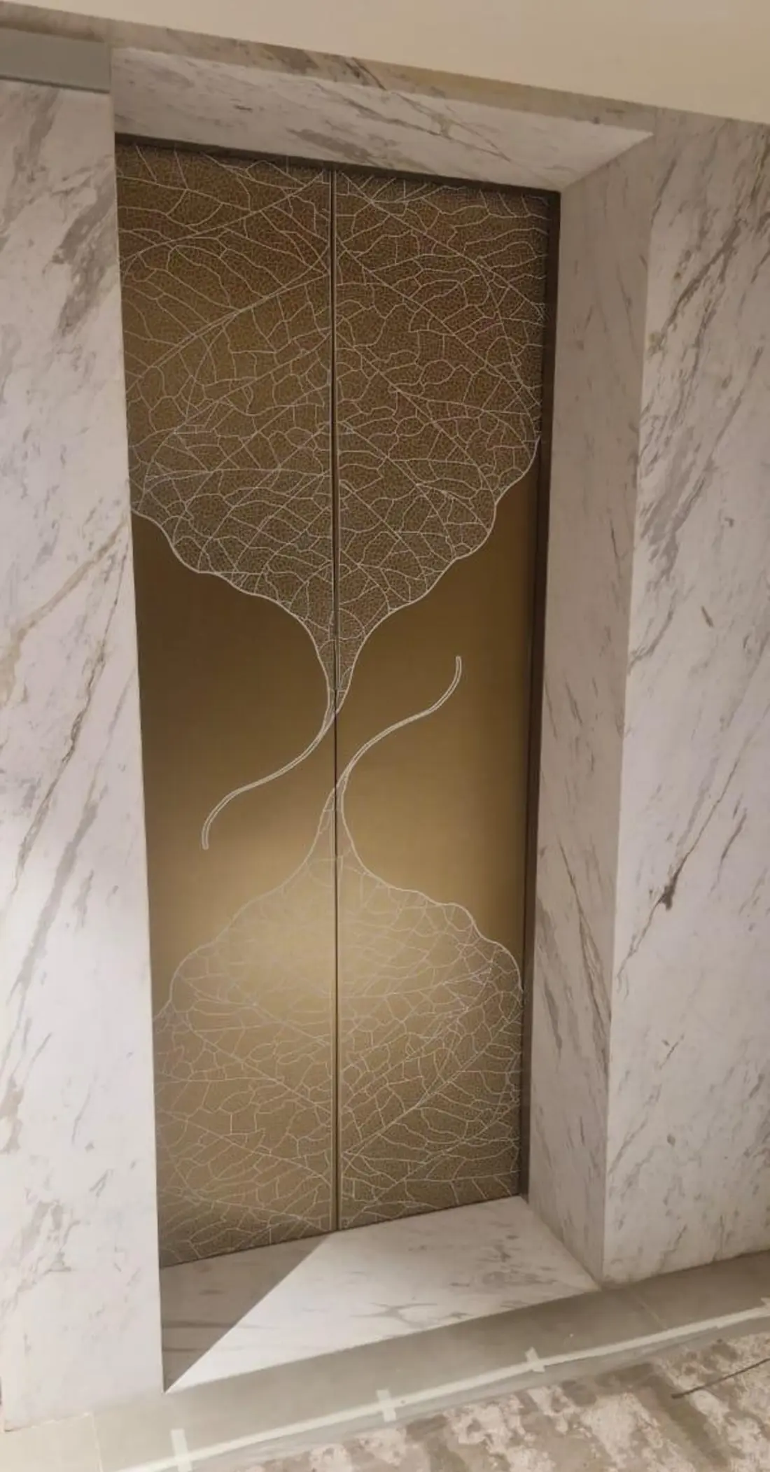 Customised patterned film on a column in a heritage courtyard